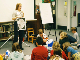 Marianne shows Moon map during Illinois visit in 2004.